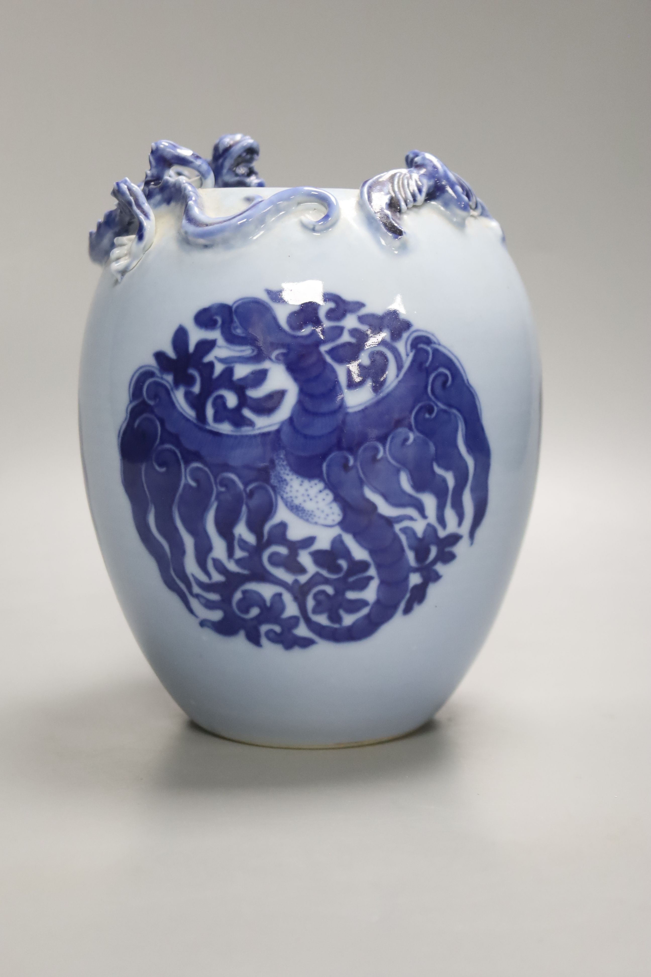 A Chinese blue ground blue and white dragon design vase, 17cm high